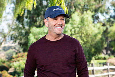 Bosley patient wearing Bosley cap